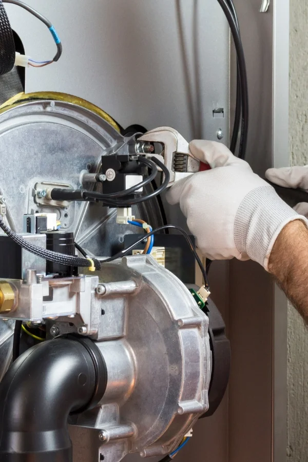 plumber hands close up repairing boiler system paonia co